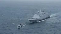 La frégate Languedoc et un hélicoptère Caïman